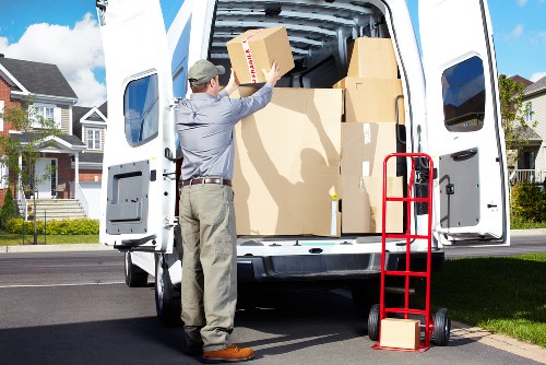 Furniture and boxes being loaded into a removals van