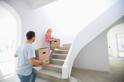 Moving team loading boxes and furniture into a van