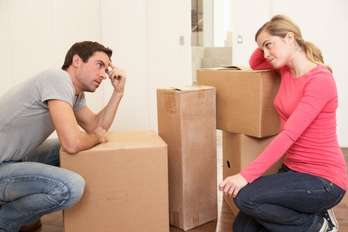 Removal crew handling furniture and boxes during a local Harringay move