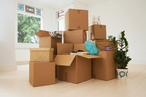 A moving team assessing risks before loading furniture into a van