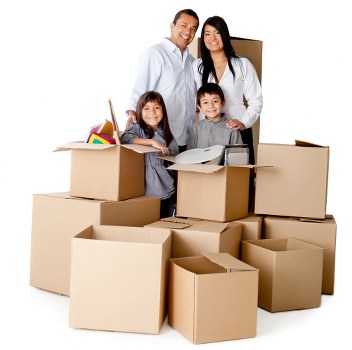 Removal team loading packed boxes and furniture for a local home move